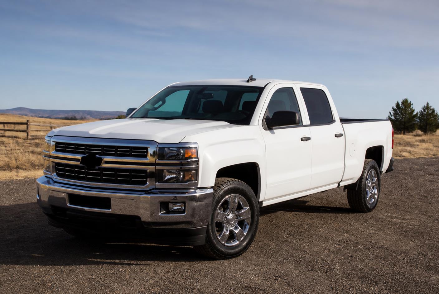 Clean white pickup truck detailed on an open Idaho lot