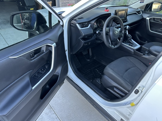 After interior detailing: clean dash, steering wheel and front seats in a white Toyota RAV4